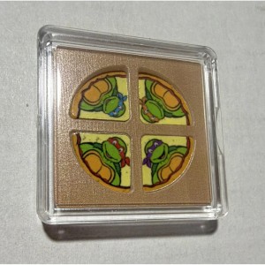 4g Silver Teenage Mutant Ninja Turtles in Pizza Shaped capsule.